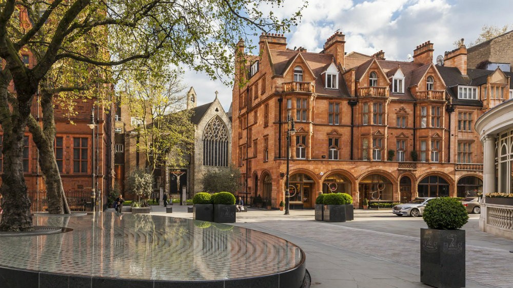 Mayfair, Mount Street gardens with Farm Street church and red-brick townhouses