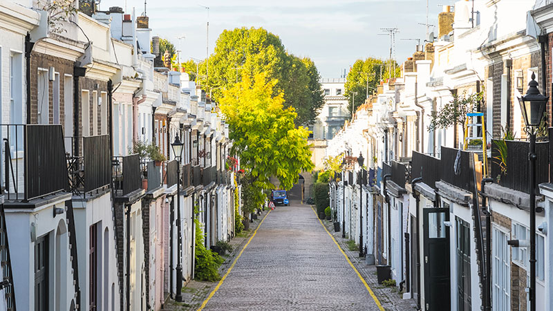 Holland Park mews house on a cobbled London street with white stucco terraces