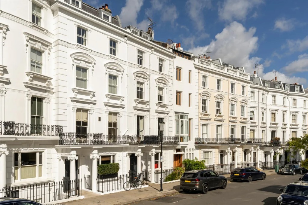 Lansdowne Terrace, white stucco townhouses on a sunlit Notting Hill street